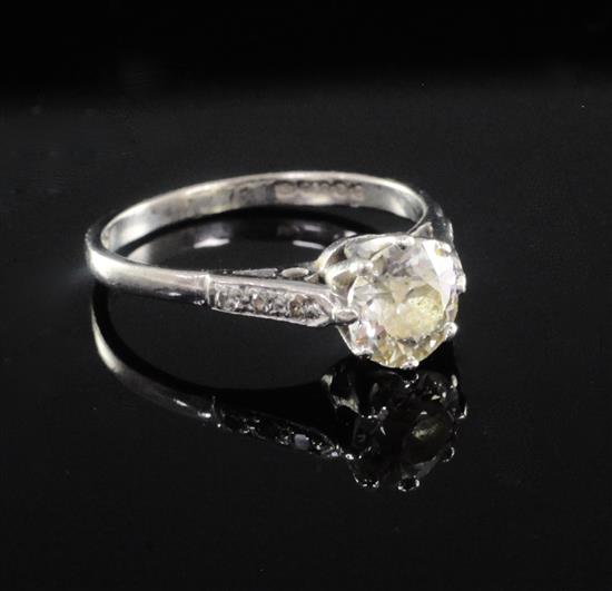 An 18ct white gold and single stone diamond ring with diamond set shoulders, size L.